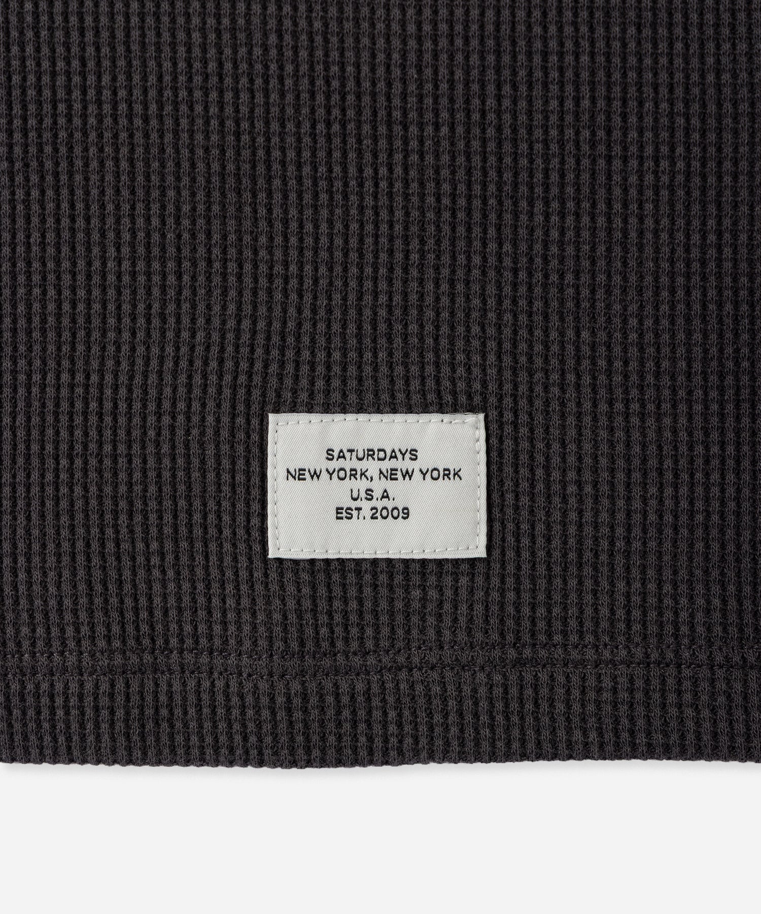 Hanes x Saturdays NYC Waffle Long Sleeve Tee in Gray, close-up of Saturdays NYC hem label